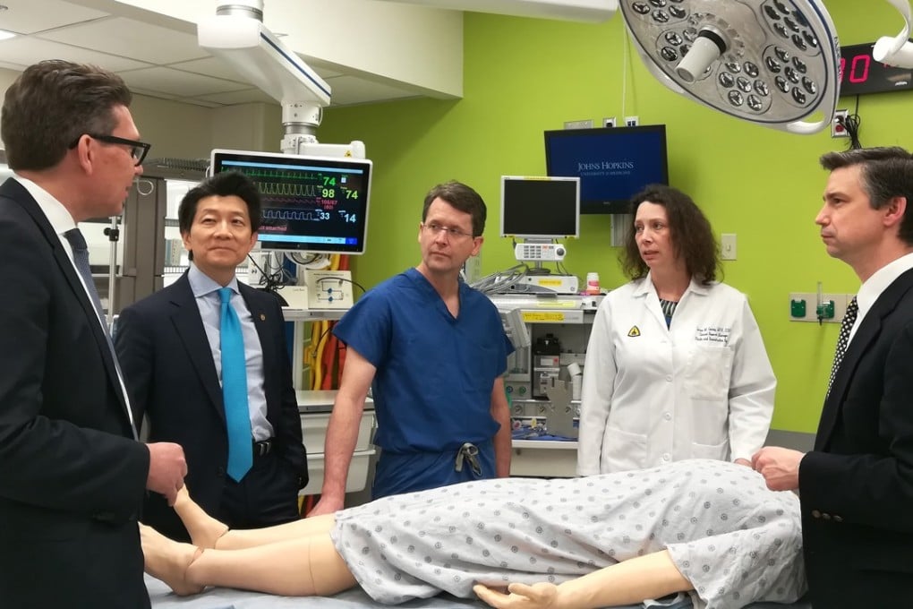 From left, Dr. Gerald Brandacher; Dr. W.P. Andrew Lee; Dr. Richard Redett; Carisa Cooney, assistant professor of plastic and reconstructive surgery; and Dr. Damon Cooney after the world's first transplant of a penis and scrotum. The recipient was a wounded US soldier. Photo: Johns Hopkins Medicine