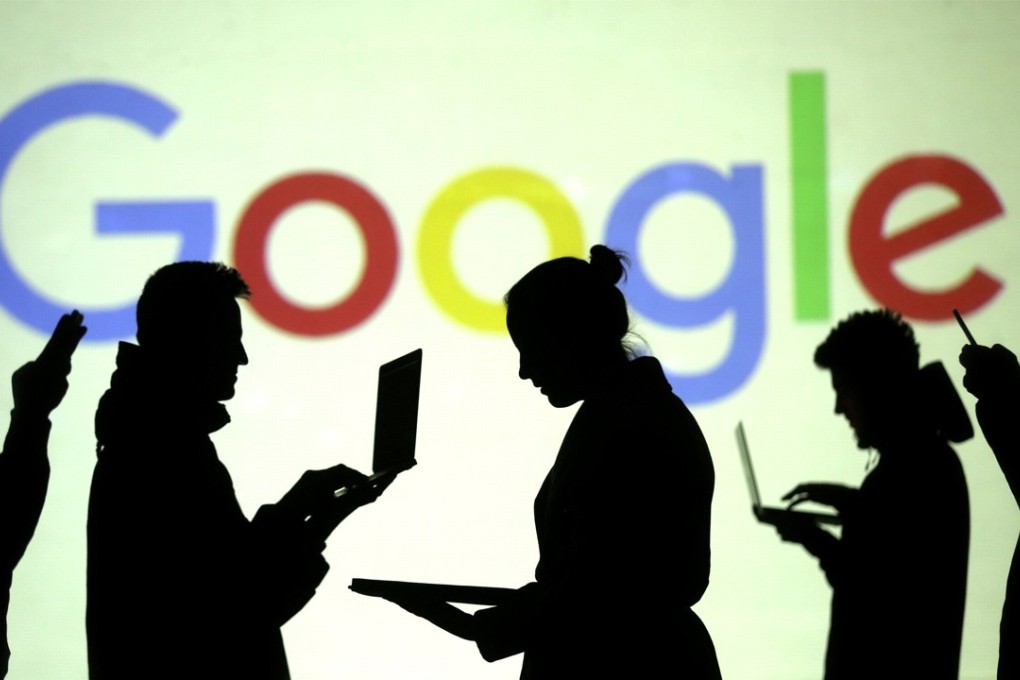 FILE PHOTO: Silhouettes of laptop and mobile device users are seen next to a screen projection of Google logo in this picture illustration taken March 28, 2018. REUTERS/Dado Ruvic/Illustration - RC1F87EA23D0/File Photo