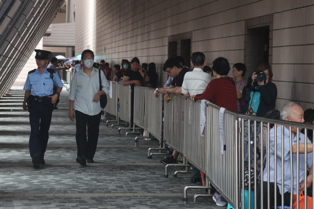 Elderly people wait outside Cultural Centre in Tsim Sha Tsui. Photo: K.Y. Cheng