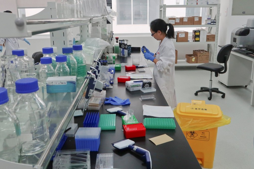 A scientist works at Zai Lab's drug development facility in Shanghai in October 2017. The Hong Kong stock exchange is amending its listing rules to attract biotech companies to list in the city. Photo: Reuters