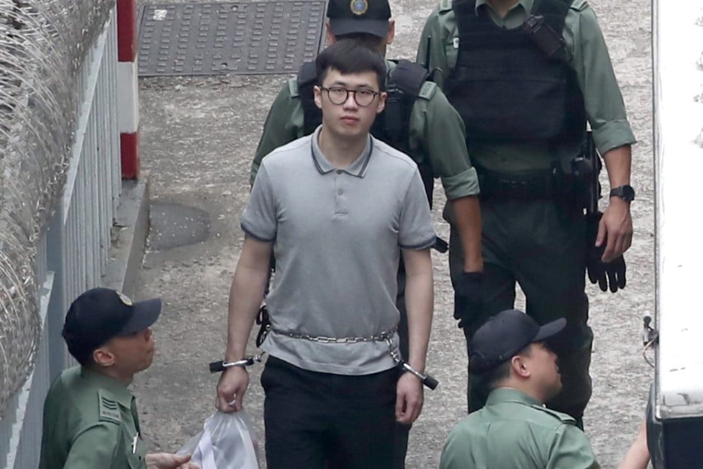 Murder suspect Keith Lau (centre with glasses) being escorted away from Lai Chi Kok Reception Centre. Photo: Edward Wong