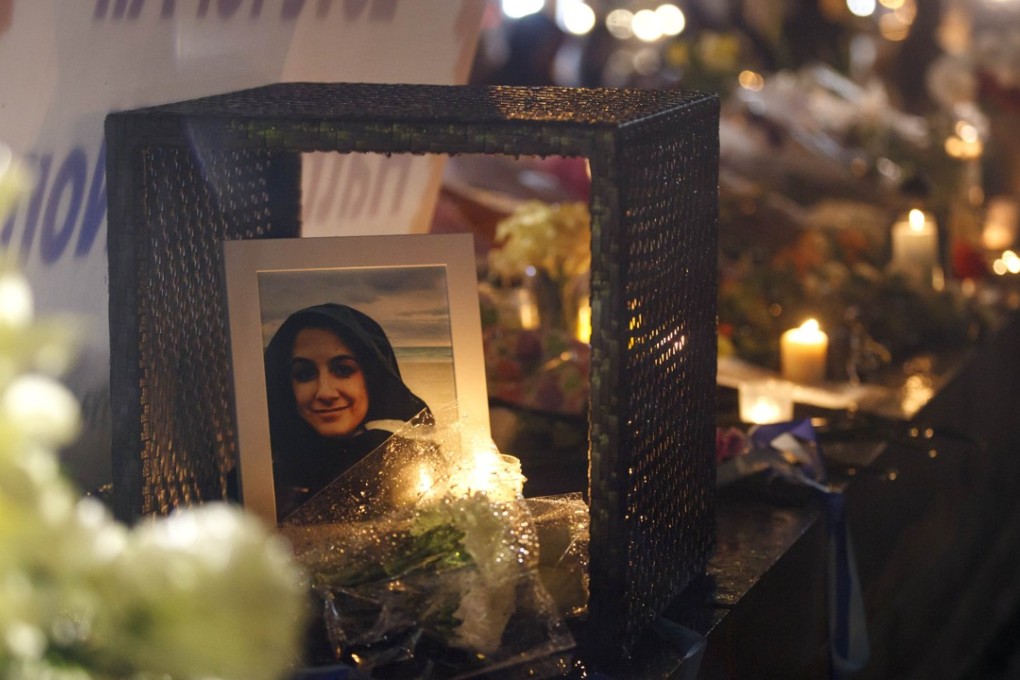 A photograph of Anne Marie D'Amico, a victim of the Toronto van mass killing, is shown at a vigil on Tuesday in Toronto, Canada. Photo: AFP