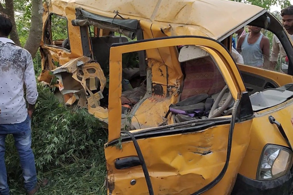 The mangled remains of a school bus after it collided with a train in Kushinagar, Uttar Pradesh, India. Photo: EPA