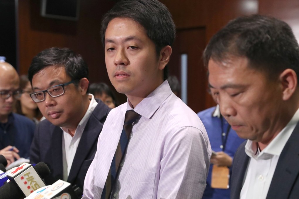 Ted Hui (centre) flanked by his Democratic Party colleagues James To (left) and Wu Chi-wai (right) as he issued an apology to the civil servant. Photo: K.Y. Cheng