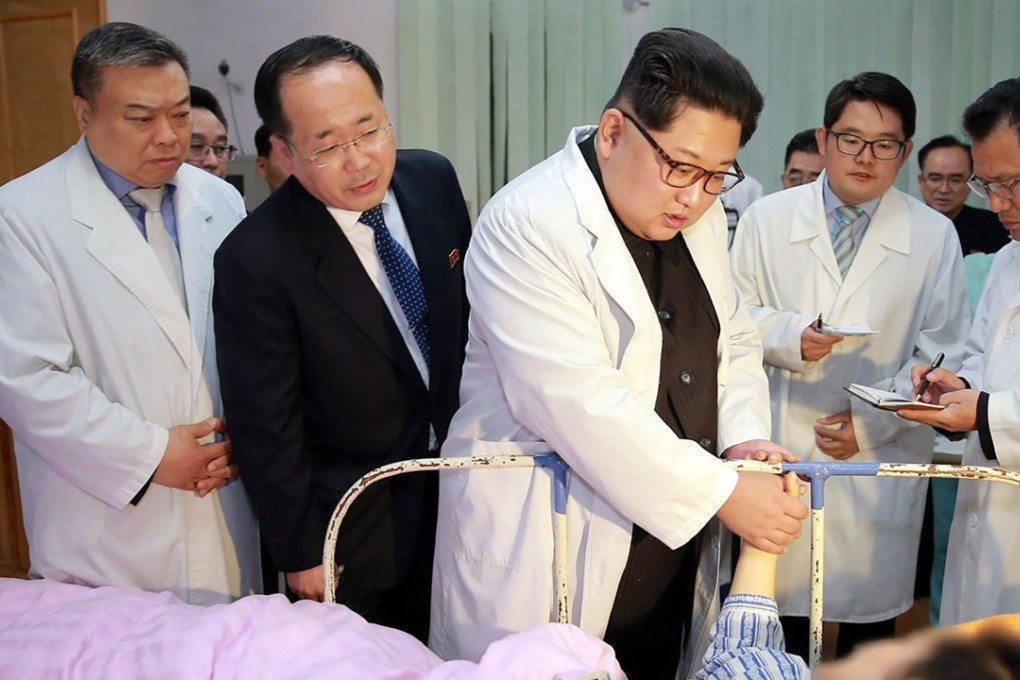 North Korean leader Kim Jong-un (centre) pictured speaking to Chinese woman injured in the accident. Photo: Agence France-Presse