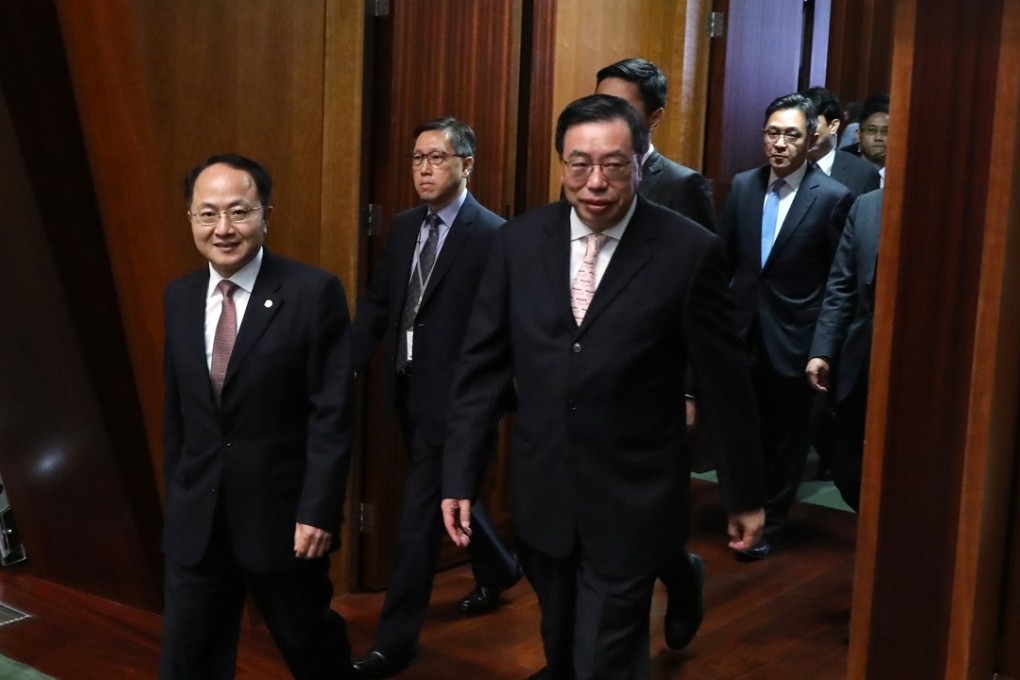 Liaison office director Wang Zhimin (front left) and Legislative Council President Andrew Leung Kwan-yuen (front-right) visit the Legislative Council Complex in Tamar. Photo: SCMP/Sam Tsang