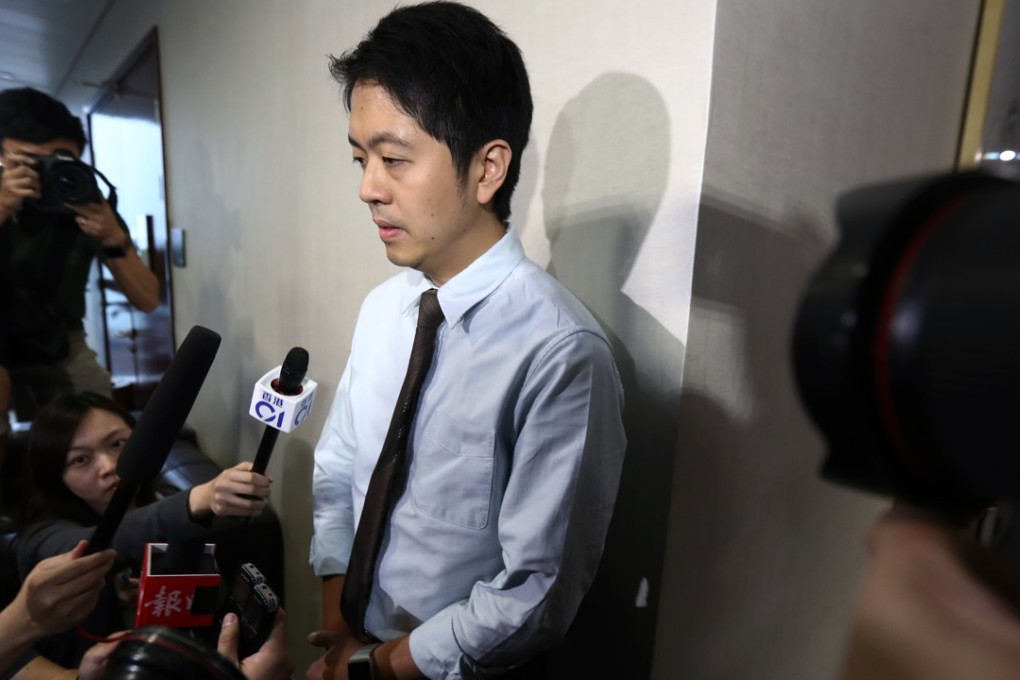Lawmaker Ted Hui Chi-fung apologising for grabbing a government official’s phone without her consent. Photo: Nora Tam