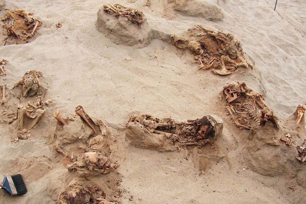 The skeletons of children are scattered across the site of a mass sacrifice that took place in Peru about 550 years ago. Photo: Gabriel Prieto / National Geographic
