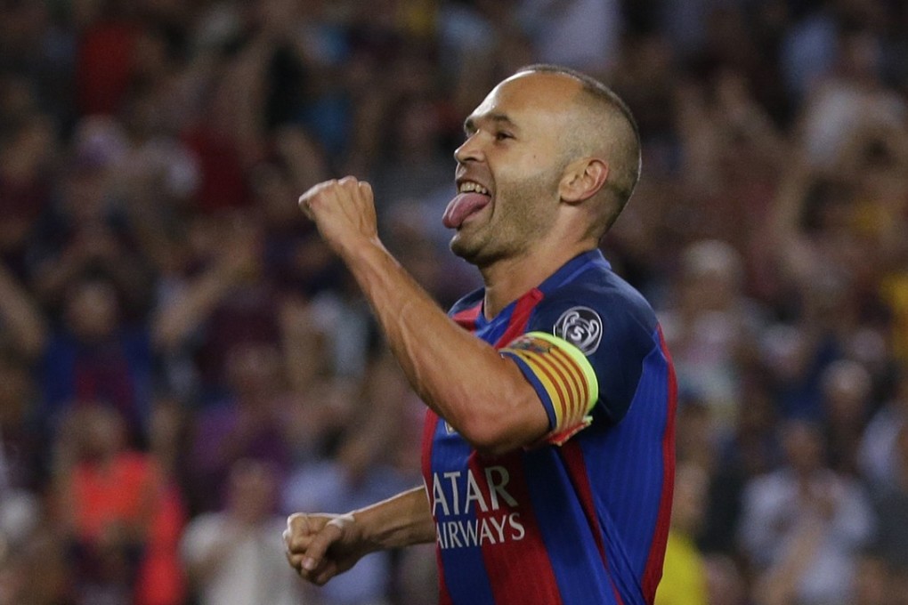 Barcelona's Andres Iniesta celebrates scoring during a Champions League match against Celtic. Photo: AP