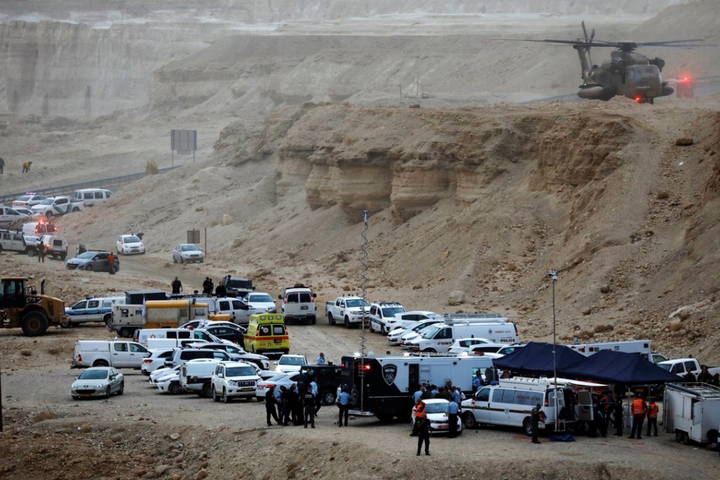 Israeli rescue services operate near the site where a group of Israeli youths was swept away by a flash flood, near the Zafit riverbed, south of the Dead Sea, on Thursday. Photo: Reuters