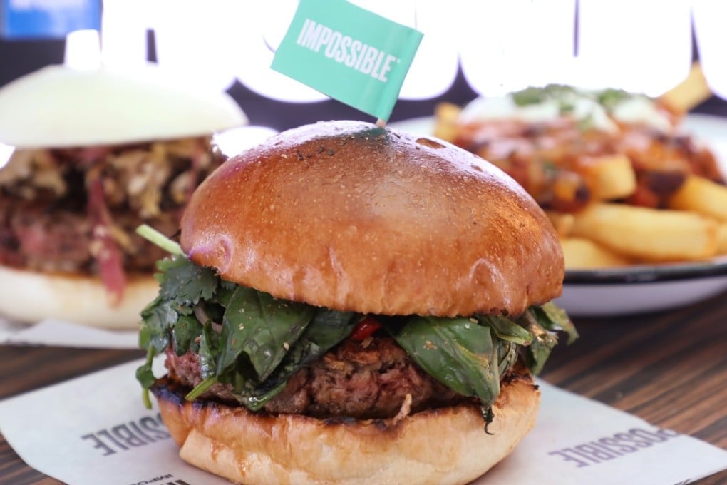 The Impossible Thai Burger (front), the Impossible Bao (behind, left) and chilli fries. Photo: Edward Wong