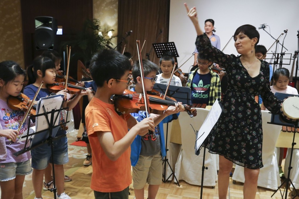 Hong Kong’s philanthropic assets are on the rise on the back of rapid wealth accumulation in Asia. An ensemble for underprivileged children is pictured giving a performance to raise funds. Photo: Dickson Lee