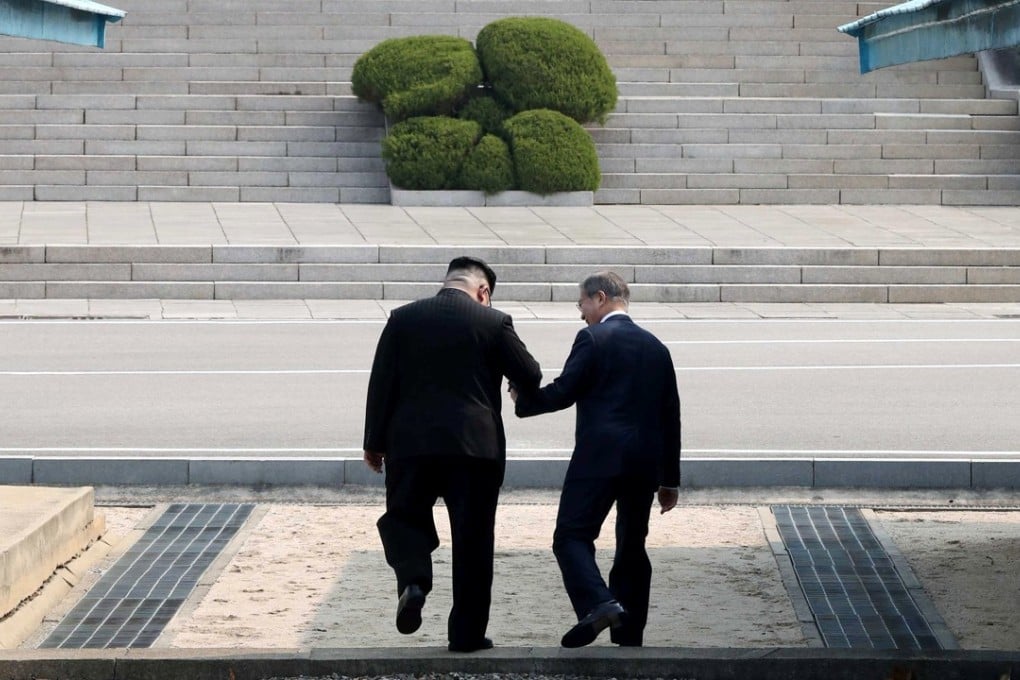 North Korean leader Kim Jong-un and South Korean President Moon Jae-in meet in the truce village of Panmunjom. Photo: Reuters