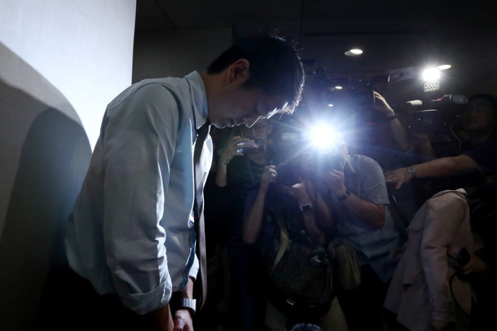 Ted Hui apologises for grabbing the phone of a government official without her consent. Photo: Nora Tam