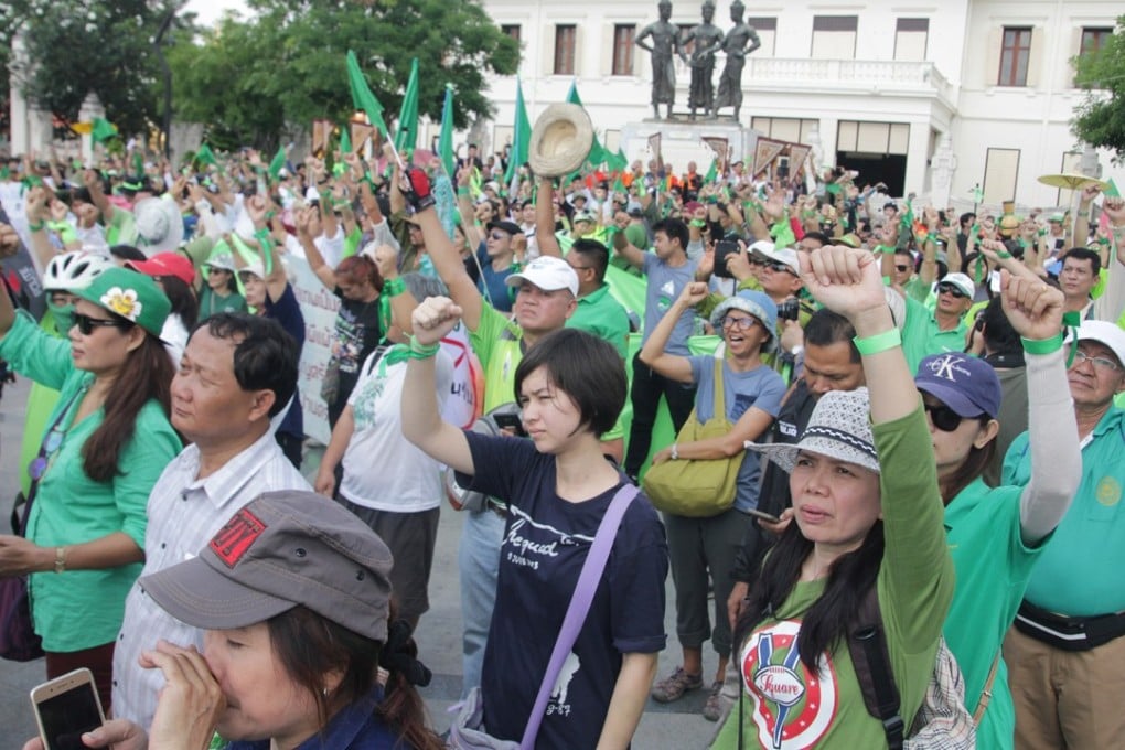 Thai demonstrators dressed in green rally in Chiang Mai on April 29, 2018. Photo: AFP