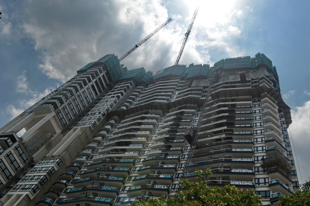 A private condominium near the business district in Singapore. A surge in en bloc purchases is boosting property prices throughout the Lion City. Photo: AFP