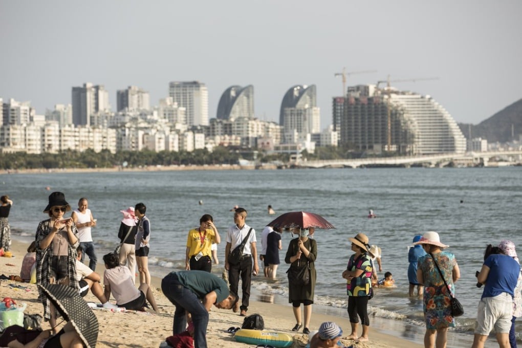 Tourists at the Sanya Bay beach on March 13, 2018. Chinese President Xi Jinping spoke at the annual Boao Forum on April 10, announcing some incentives and policies to spur growth in the island province. Photo: Bloomberg.