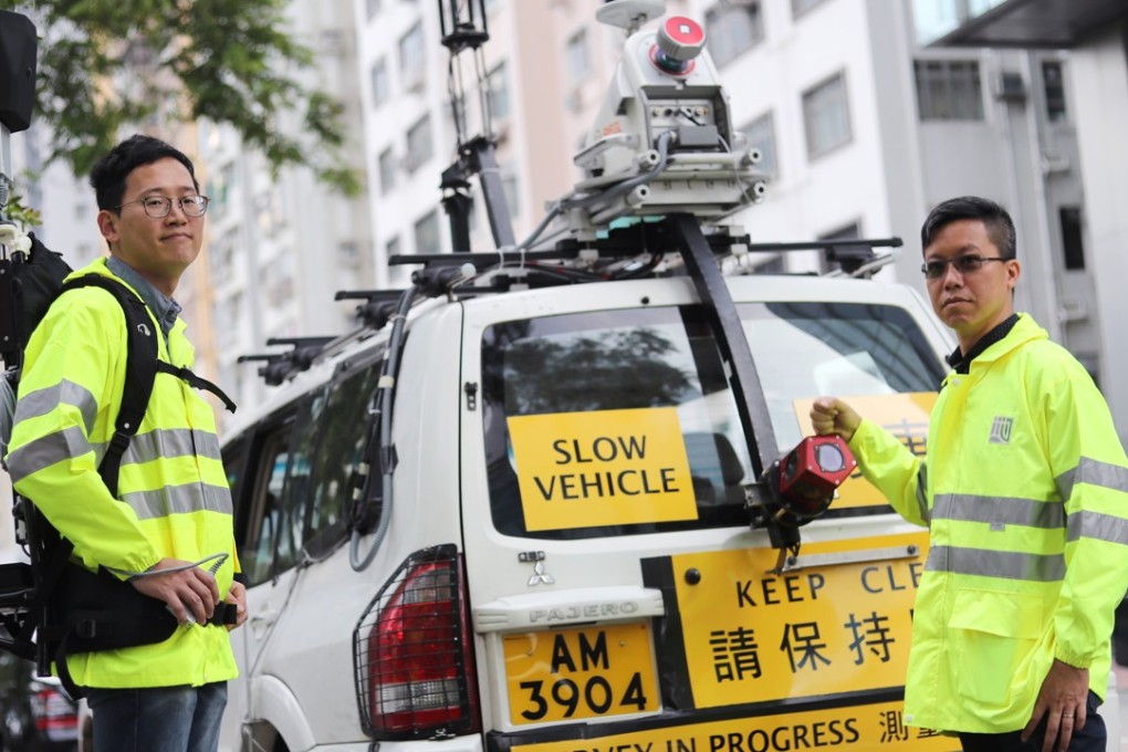 Land surveyors, Ng Wai-wang (left) and Eddie Ho with the vehicle used to map out Hong Kong’s roads. Photo: Winson Wong