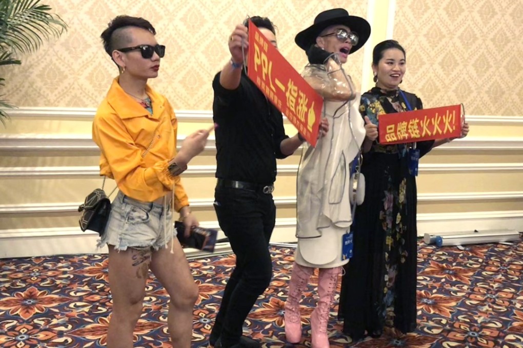 Entertainers try to drum up interest in a blockchain product at a conference in Macau. Pthoto: Orange Wang