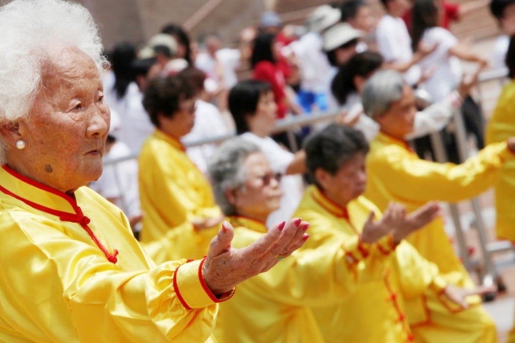 Elderly Hongkongers practise tai chi together to raise money for seniors who live alone, in Tsim Sha Tsui in March 2010. Photo: Nora Tam