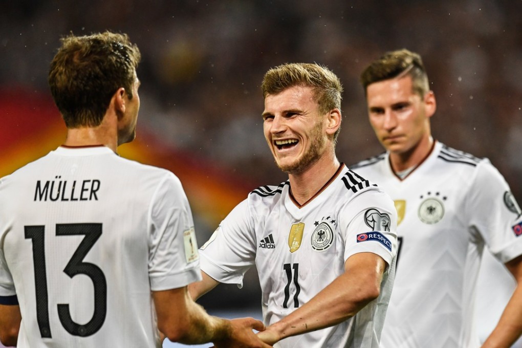 Germany’s players celebrate a goal in World Cup qualifying. Photo: EPA