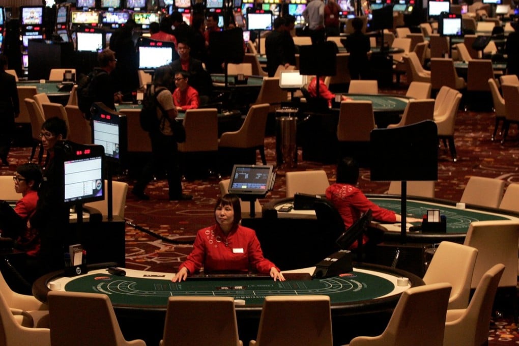 Dealers wait for customers at Melco Crown Entertainment’s City of Dreams gaming resort in Macau. Photo: Reuters