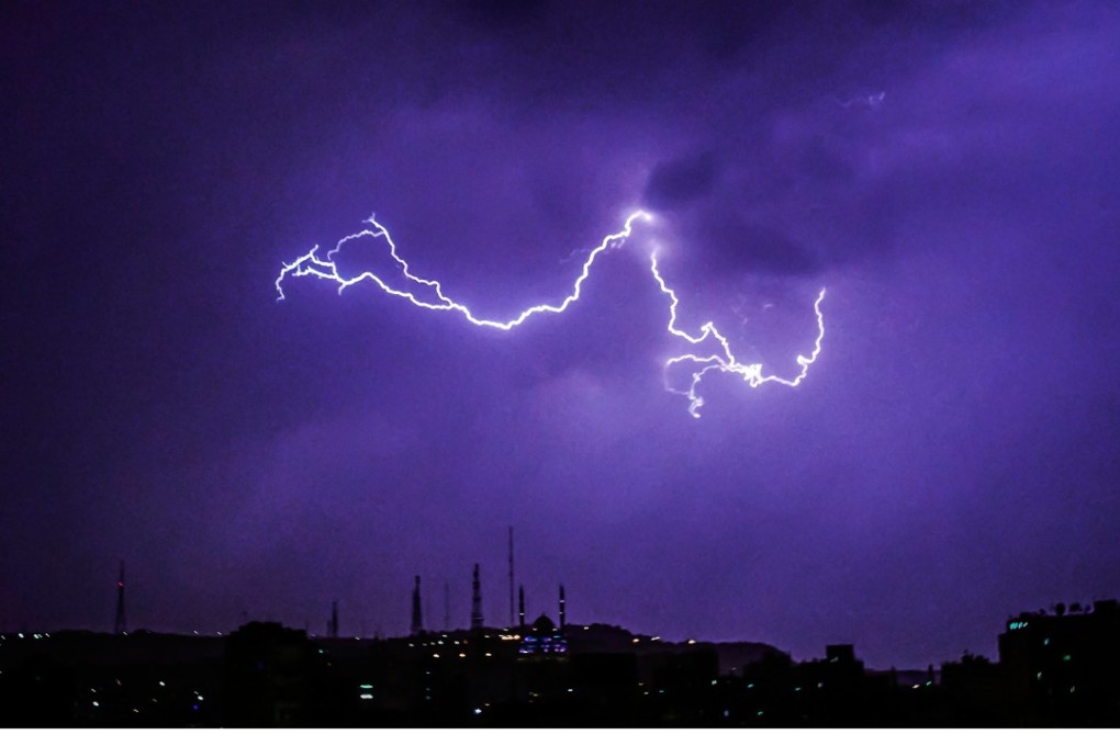 Lightning crackles over Cairo in this April 24 photo. Photo: AP