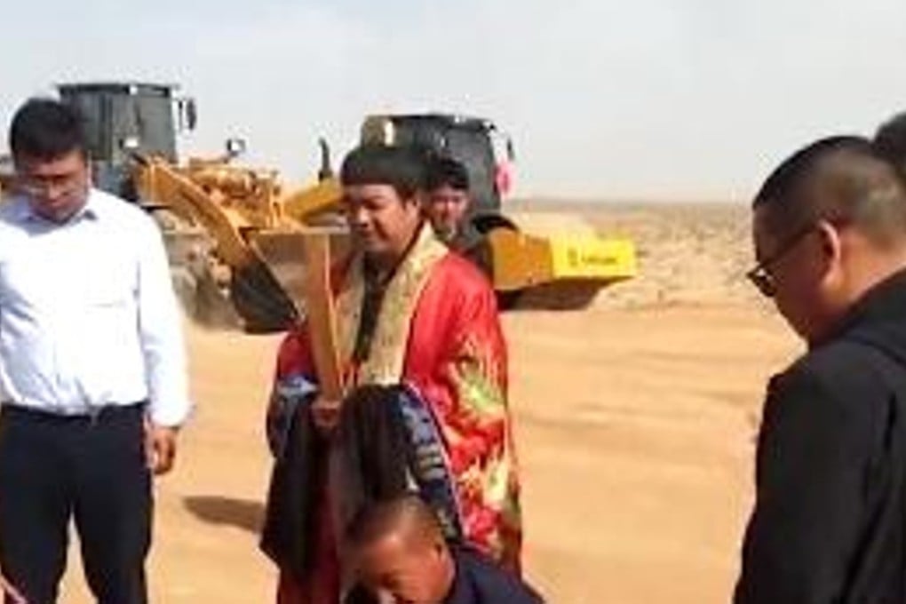 A man dressed as a Taoist priest performs a ritual during a groundbreaking ceremony at a Shanghai Institute of Applied Physics reactor site in Wuwei, Gansu province. Photo: Handout