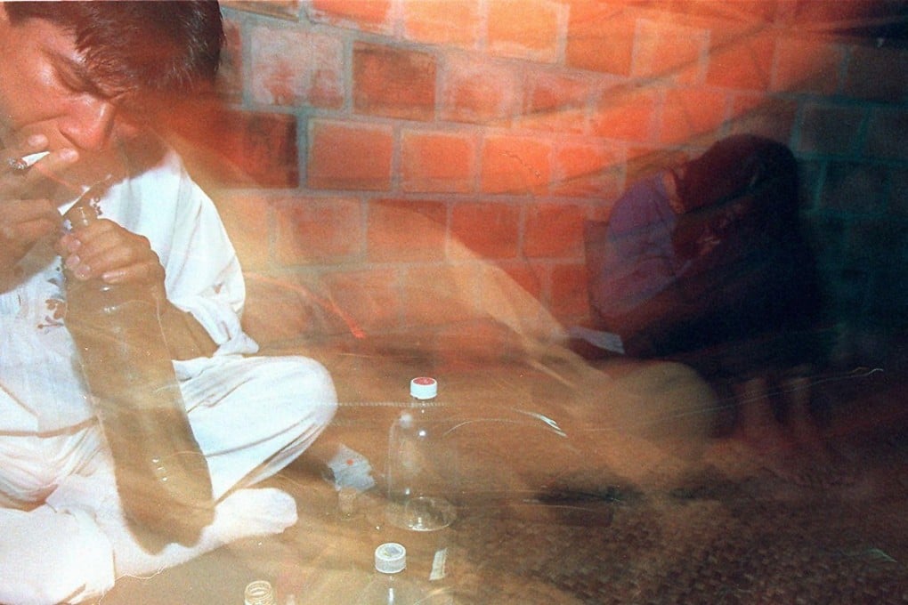 In this file photo, a shaman healer performs a traditional ritual in which tobacco smoke is blown over Ayahuasca extract. In the ritual, the shaman sings “icaros” or healing songs after patients have drunk the extract. The songs are supposed to protect and guide the patients while under the hallucinogenic influence of the Ayahuasca extract. Photo: Agence France-Presse