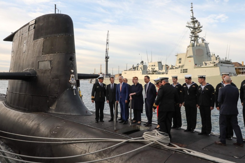 French President Emmanuel Macron (second left) and Australian Prime Minister Malcolm Turnbull (third left) on the deck of HMAS Waller, a Collins-class submarine operated by the Royal Australian Navy. Photo: AFP