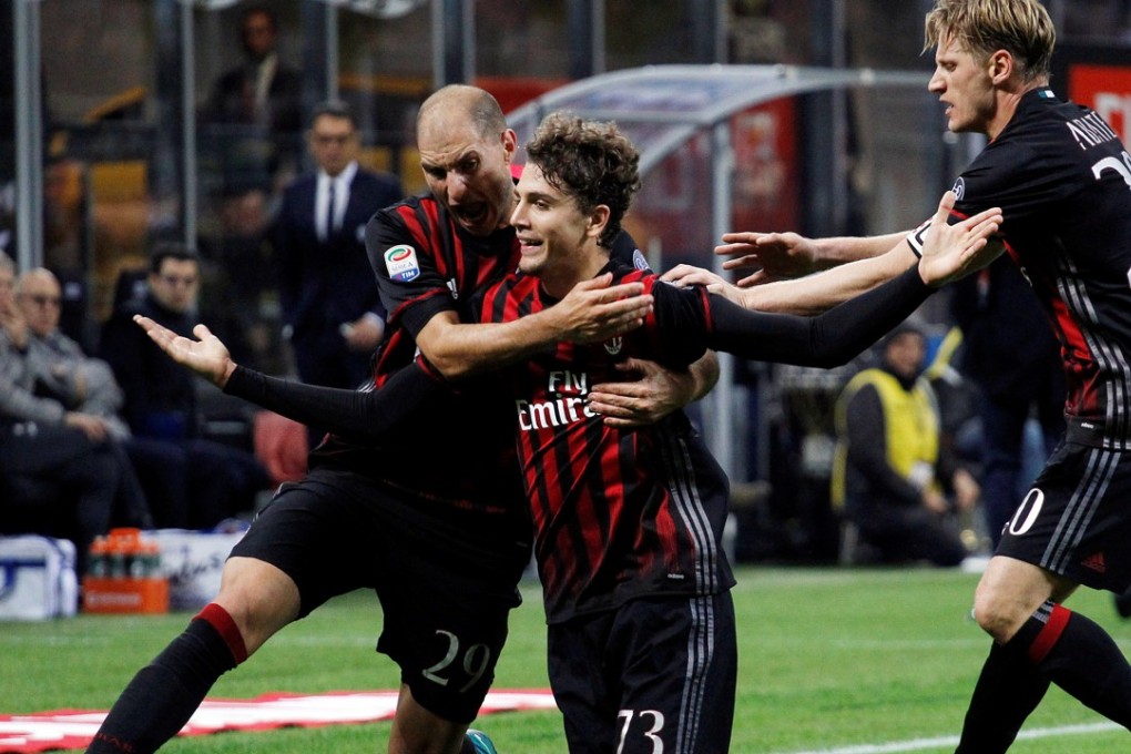 Gabriel Paletta celebrates an AC Milan goal against Juventus. Photo: Reuters