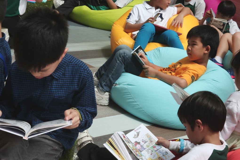 Young readers at the Hong Kong government’s “My Pop-up Library” event, part of the 2018 World Book Day Fest, in Sham Shui Po on April 21. Photo: Jonathan Wong