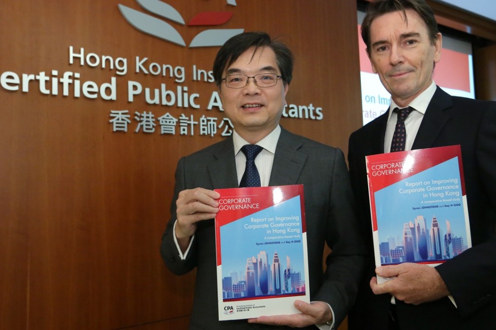 Raphael Ding, (left) chief executive of Hong Kong Institute of Certified Public Accountants and Syren Johnstone, principal lecturer at the University of Hong Kong, release the corporate governance report on Wednesday. Photo: Edmond So