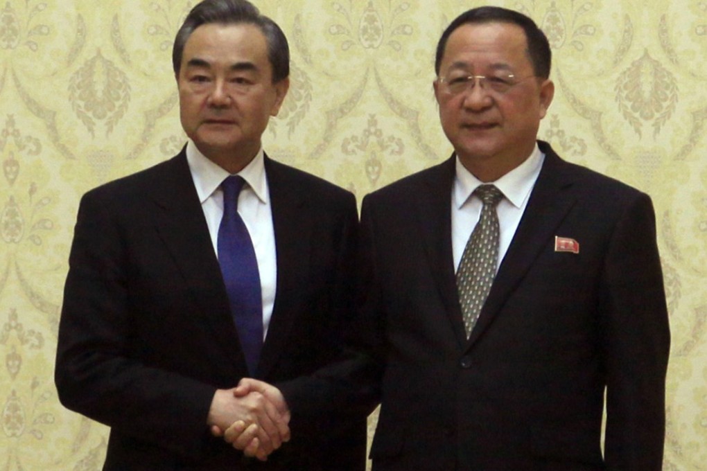 Chinese Foreign Minister Wang Yi (left) poses with his North Korean counterpart Ri Yong-ho in Pyongyang on Wednesday. Photo: AP