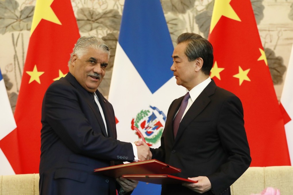 Dominican Republic Foreign Minister Miguel Vargas (left) pictured with his Chinese counterpart Wang Yi after a signing ceremony in Beijing where they formally established diplomatic relations between their two countries. Photo: EPA-EFE