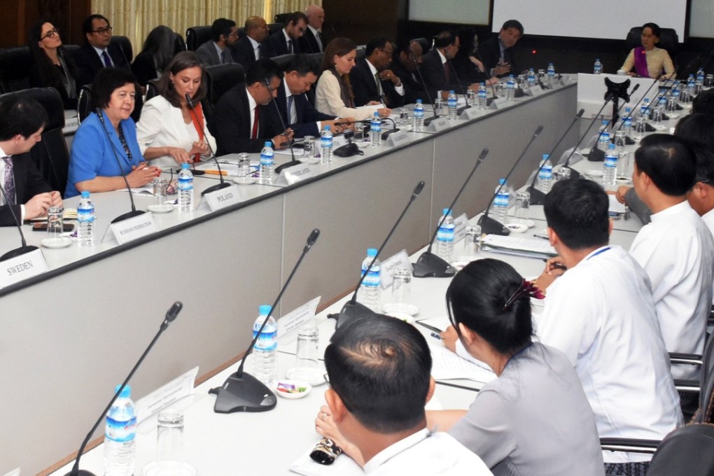 Myanmar's State Counselor Aung San Suu Kyi, center, meets with a UN Security Council team in Naypyidaw, Myanmar, on Monday, in this handout photo made available by the Myanmar’s Ministry of Information (MOI). Photo: EPA-EFE/MOI