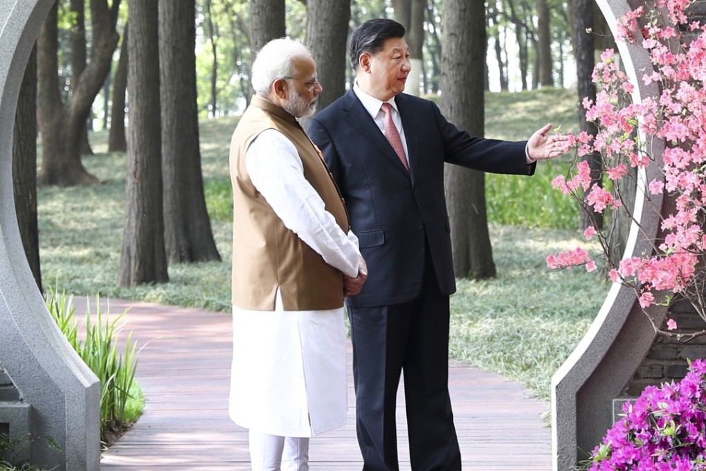 Indian Prime Minister Narendra Modi and Chinese President Xi Jinping talk at a garden in Wuhan in central China's Hubei Province on April 28. Photo: Xinhua via AP
