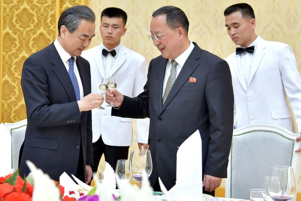 Wang Yi (left) and Ri Yong-ho have sought to strengthen their countries’ “traditional friendship” during two days of talks in Pyongyang. Photo: AFP