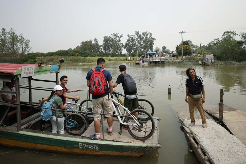 Visitors on a boat in Nam Sang Wai, where a fire broke out. Photo: Winson Wong