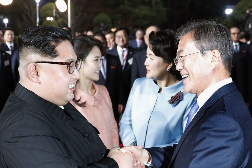 North Korean leader Kim Jong-un and South Korean President Moon Jae-in bid farewell at the border village of Panmunjom on April 27 following their summit meeting. Photo: Kyodo