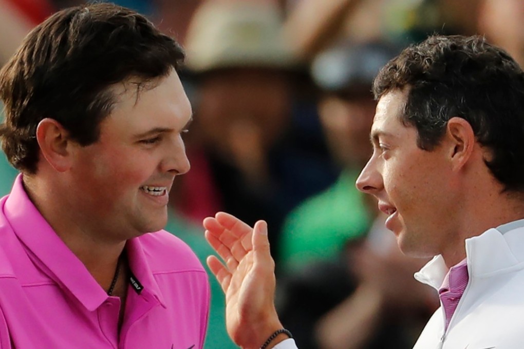 Rory McIlroy (right) congratulates Patrick Reed on his Masters win. Photo: AP