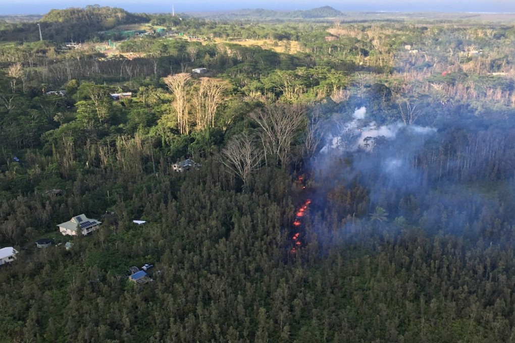 In this photo provided bt the US Geological Survey, lava can been seen in the Leilani Estates subdivision in the lower East Rift Zone of Kilauea Volcano on Hawaii's Big Island on Thursday. Photo: Agence France-Presse