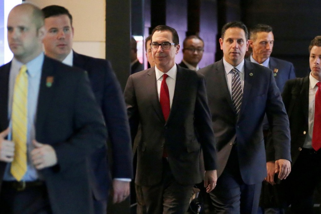 US Treasury Secretary Steven Mnuchin, center, and the US delegation for trade talks with China, leave a hotel in Beijing, China on Thursday. Photo: Reuters