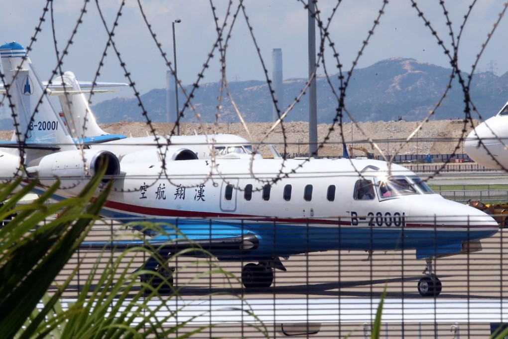 A private jet, with one of the five Hong Kong people who were injured in an explosion at a water park in Taiwan, arrives at Hong Kong International Airport in June 2015. Photo: David Wong