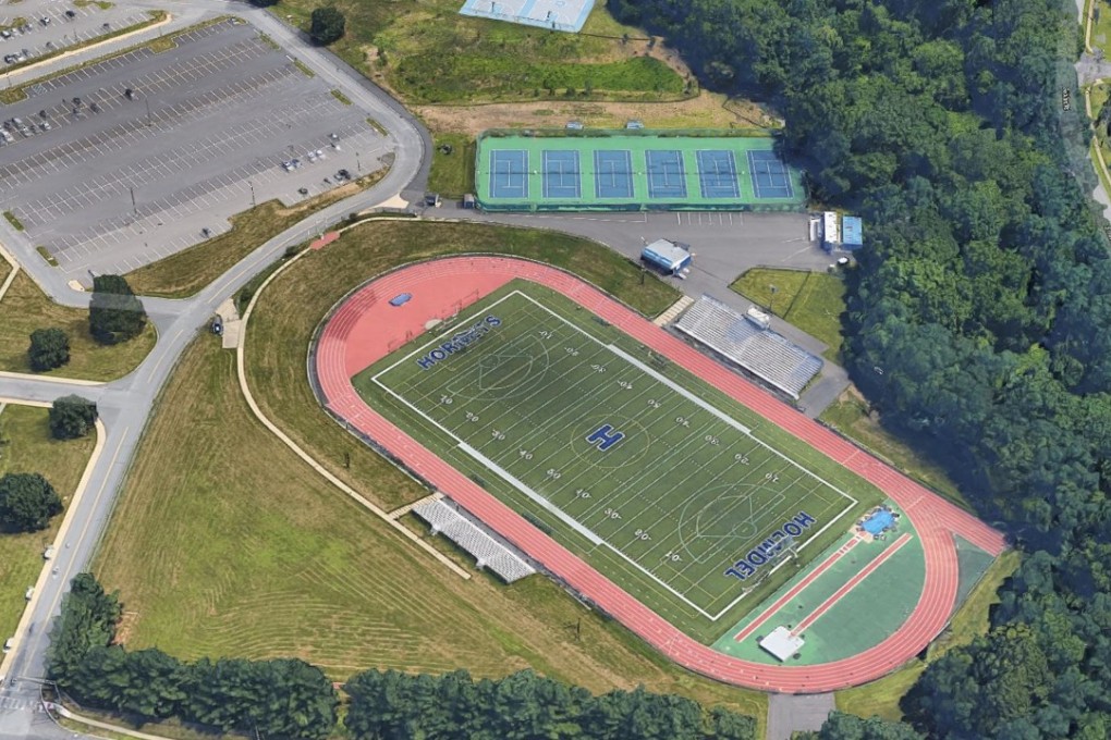 Holmdell High School's track and football field (pictured) have been afflicted by human faeces on several occasions. On Monday April 30, police charged the school's superintendent with befouling the property. Picture: Google Earth