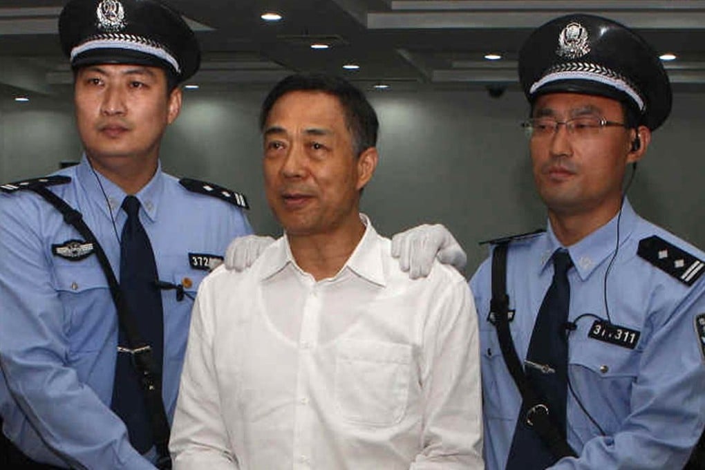 Former Chinese political star Bo Xilai stands in a courtroom in Jinan, east China's Shandong province. Bo was sentenced to life in prison. Photo: AFP