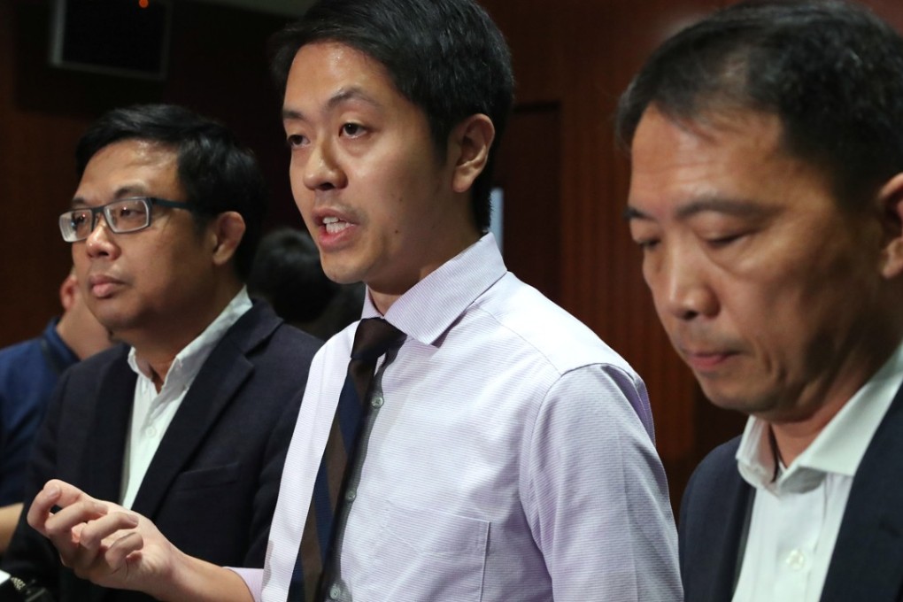 Ted Hui (centre), with fellow Democratic Party lawmakers James To Kun-sun (left) and Wu Chi-wai, at a press conference at the Legislative Council complex on April 25. Hui apologised for grabbing a civil servant’s mobile phone. Photo: K.Y. Cheng