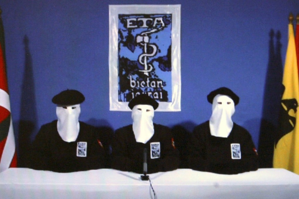 A scene from a video posted on the website of Basque newspaper Gara, on January 10, 2011 shows Basque Separatists ETA members announcing a “permanent, verifiable ceasefire”. On Thursday, ETA announced that it was disbanding completely. Photo: EPA