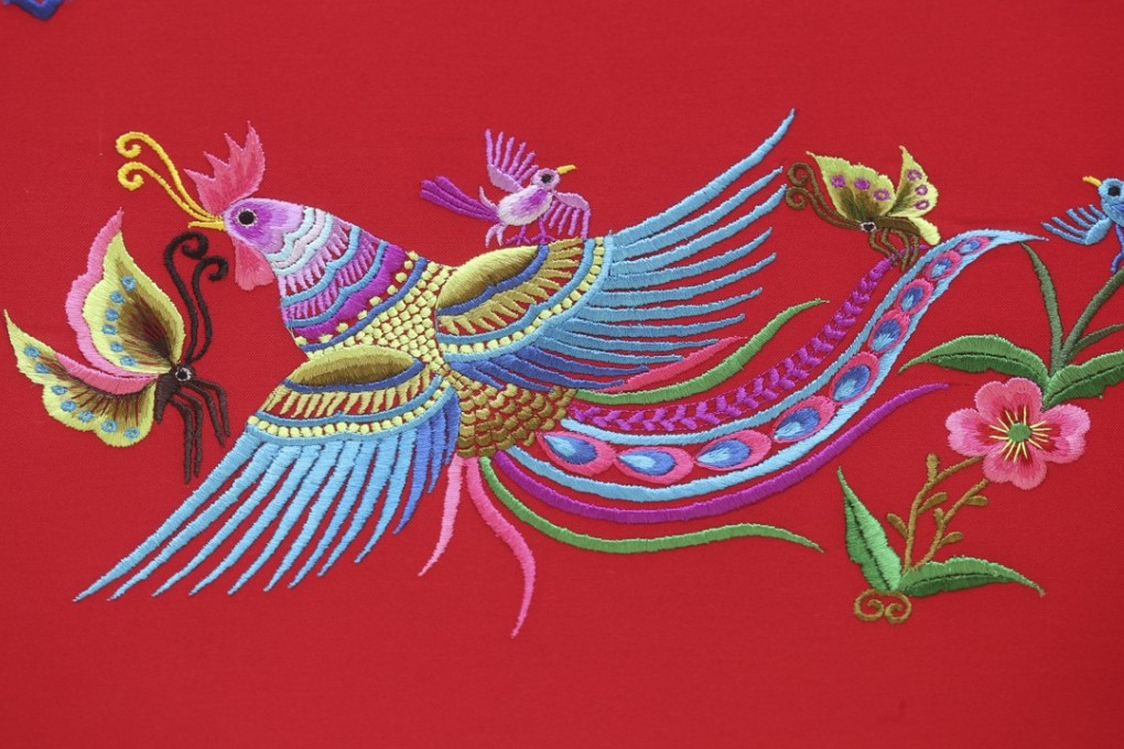 Traditional Zhuang embroidery designs use deep and bright colours to flesh out flowers, butterflies, birds and water ripples. Photo: K.Y. Cheng