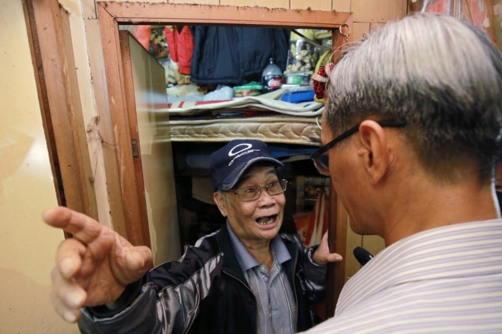Task force on land supply chairman Stanley Wong visits subdivided flats in Sham Shui Po. Photo: Pool